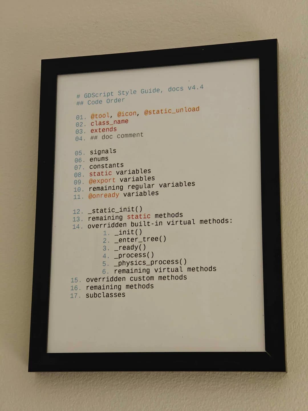 A framed picture of the GDScript Style Guide with some common functions, keywords, and decorators.